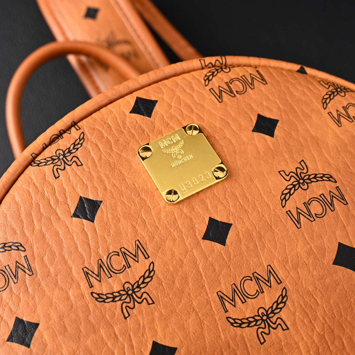 Mcm Stark Visetos Medium Backpack – Cognac Monogram with Gold-Tone Studs - Cognac with Black Monogram Print