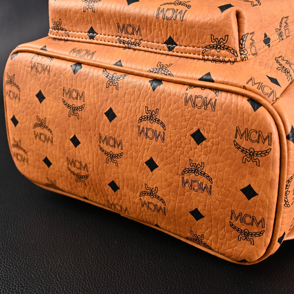 Mcm Stark Visetos Medium Backpack – Cognac Monogram with Gold-Tone Studs - Cognac with Black Monogram Print