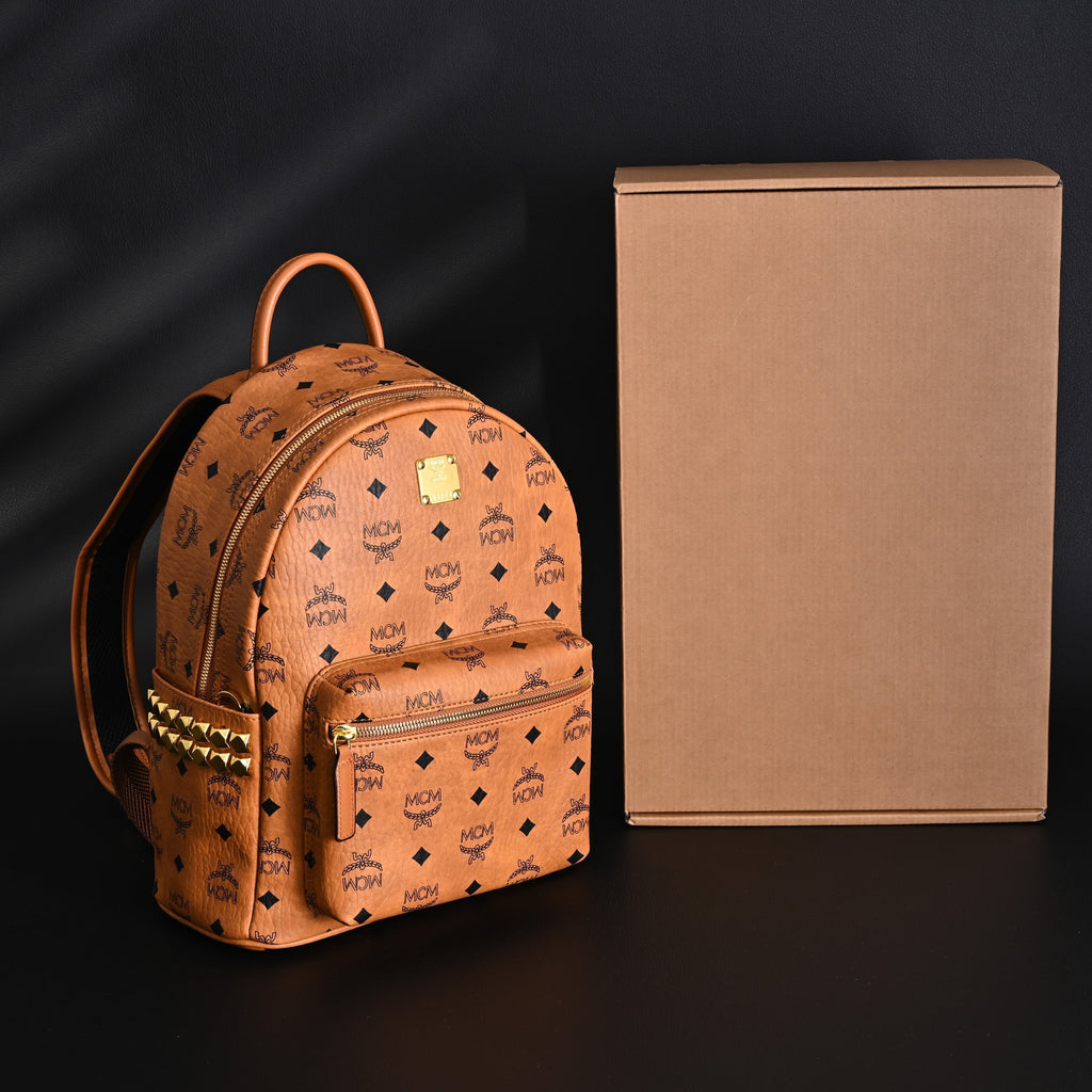 Mcm Stark Visetos Medium Backpack – Cognac Monogram with Gold-Tone Studs - Cognac with Black Monogram Print
